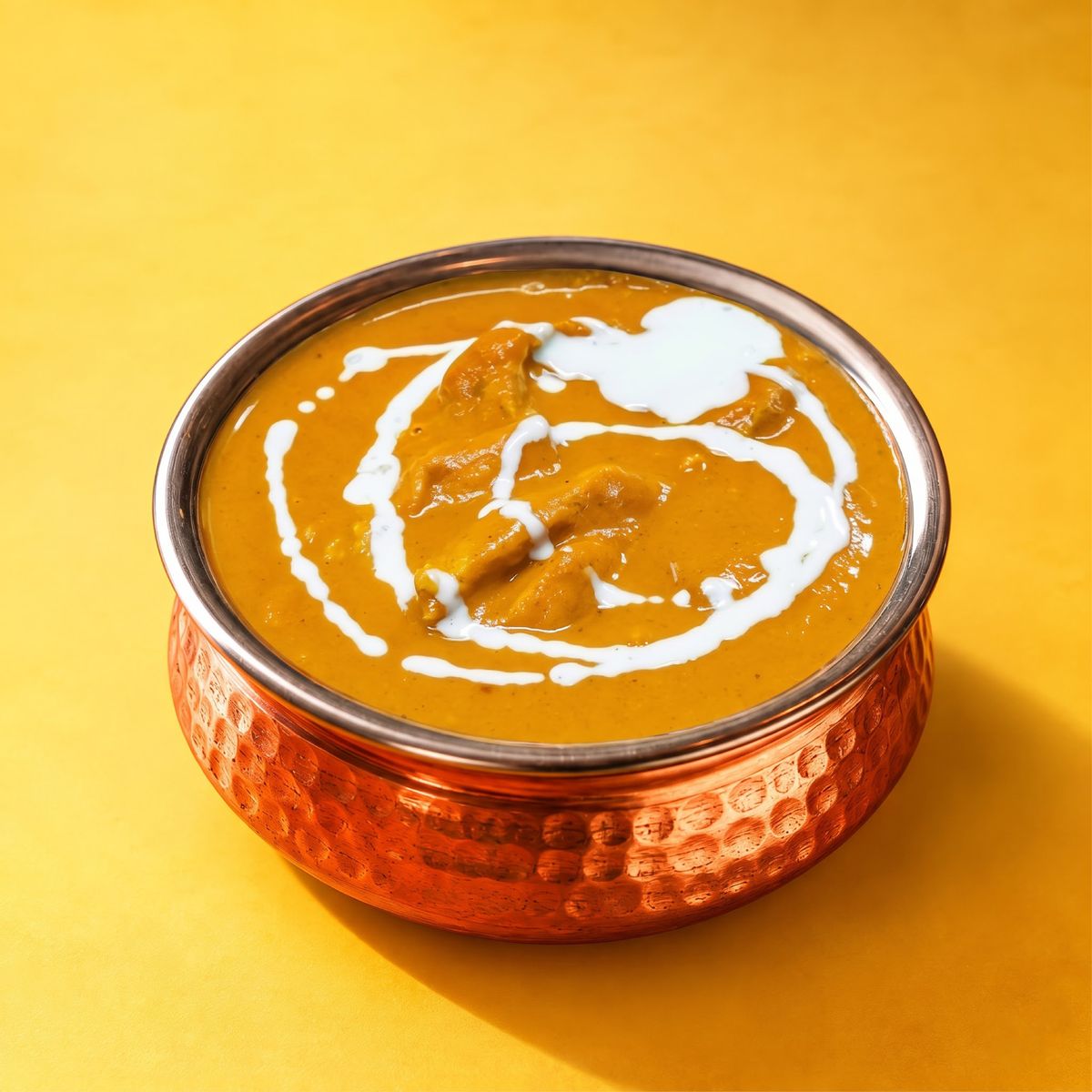 Chicken korma with a swirl of cream