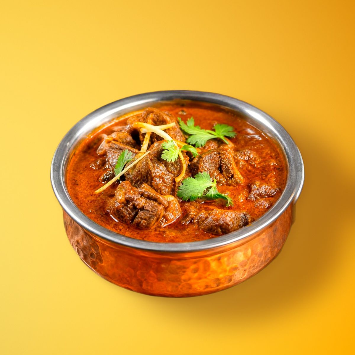 Lamb rogan josh in a copper bowl